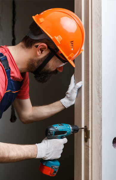 Residential locksmith from Fortify Services installing door lock trusted lock installation in Toronto, Mississauga, Brampton, Hamilton