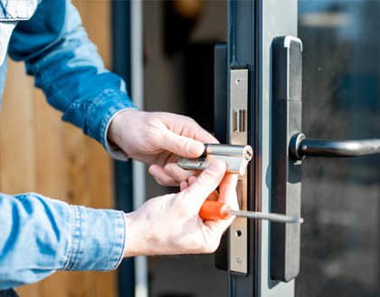 Locksmith repairing door lock in Ontario – Fortify Services