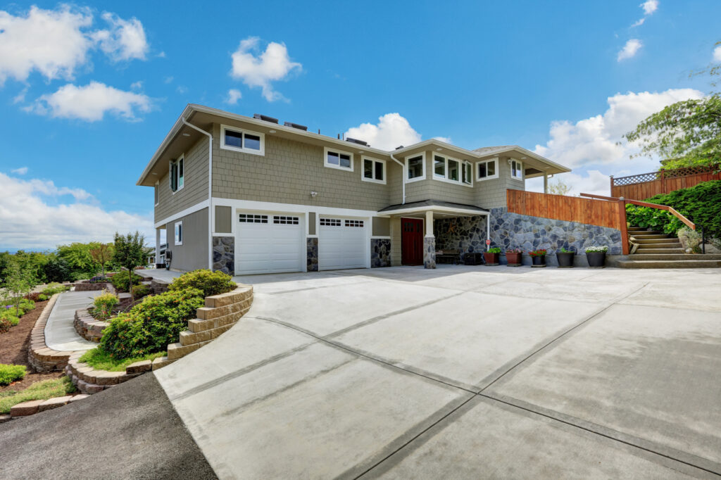 Modern residential garage doors on Canadian home driveway