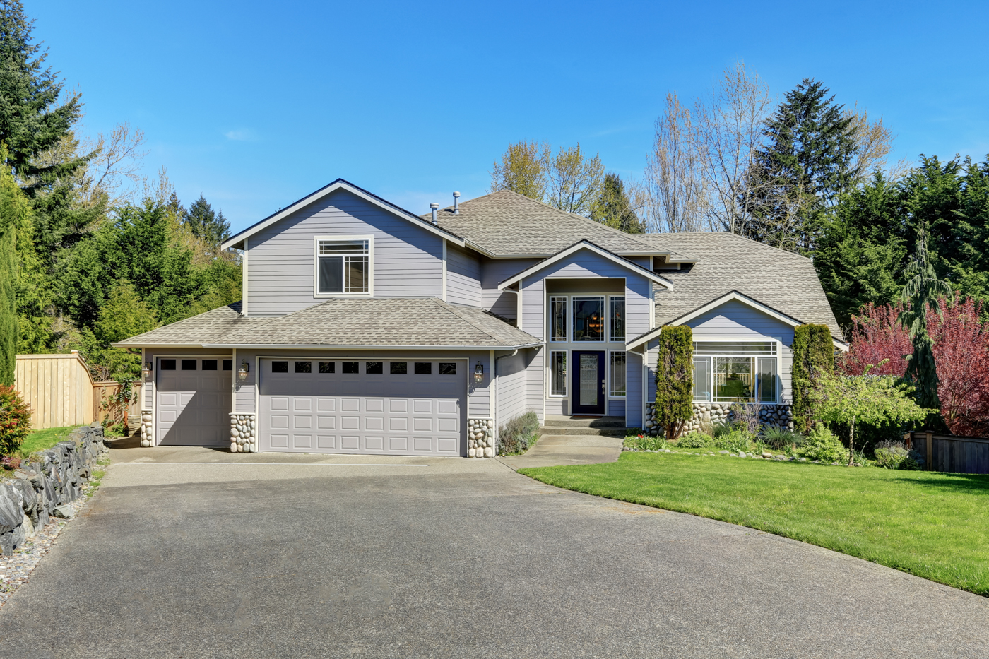 Modern residential garage doors on Canadian home driveway