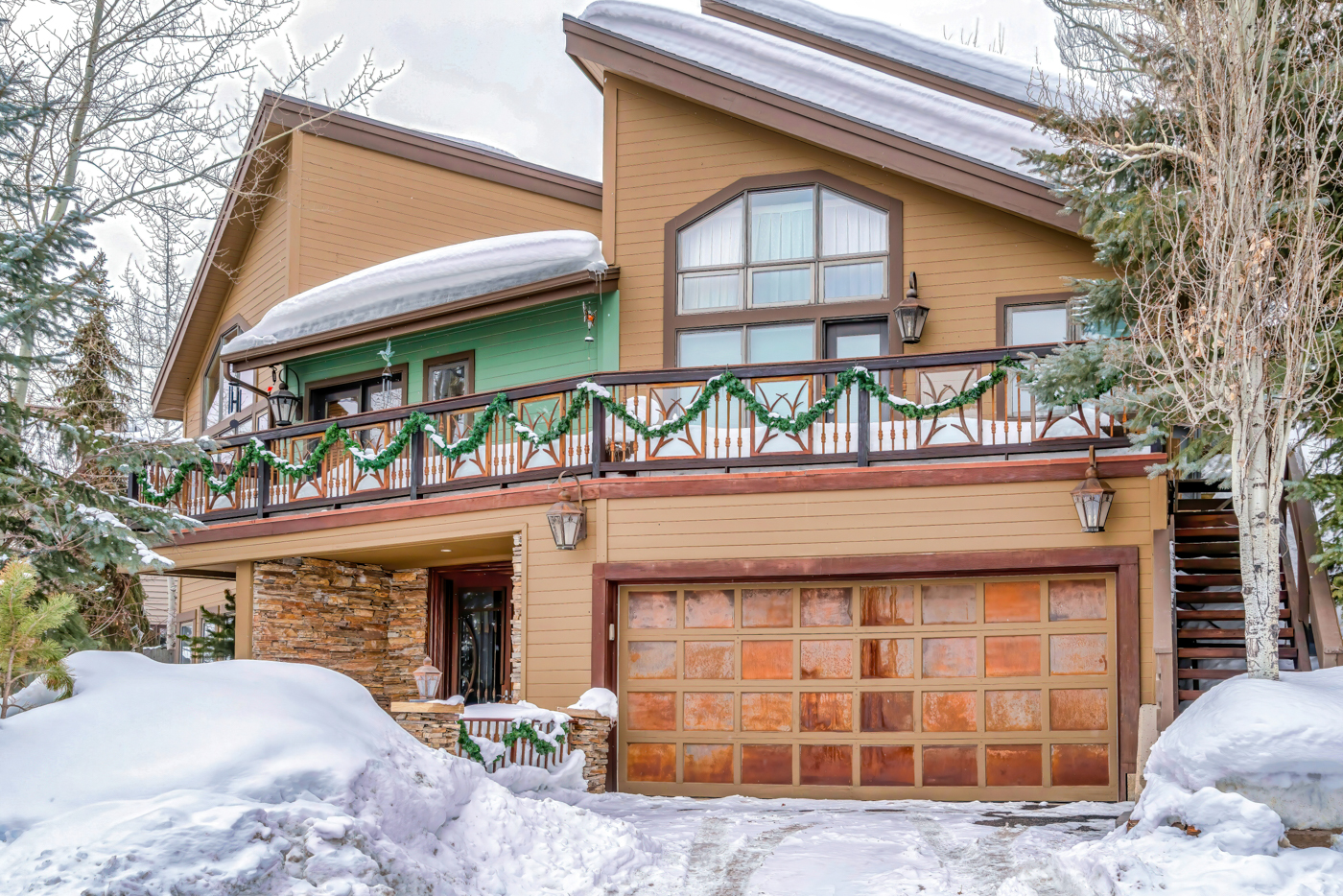 Wood garage door on snowy Canadian home