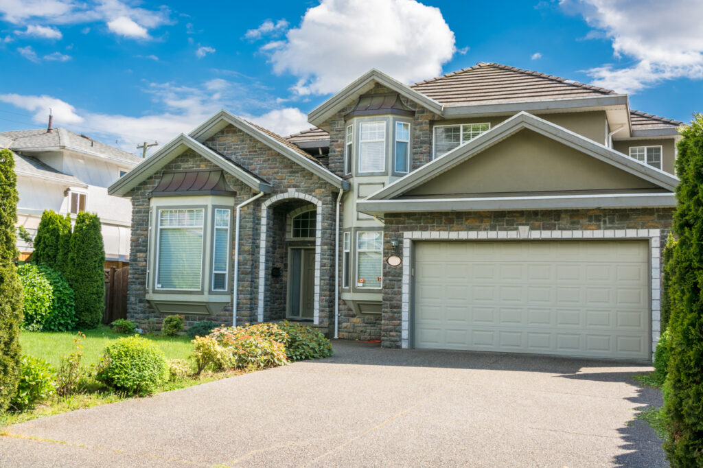 Modern residential garage door on Canadian home driveway