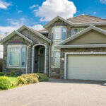 Modern residential garage door on Canadian home driveway
