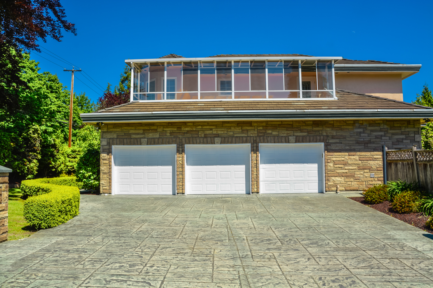 White residential garage door on brick Canadian home