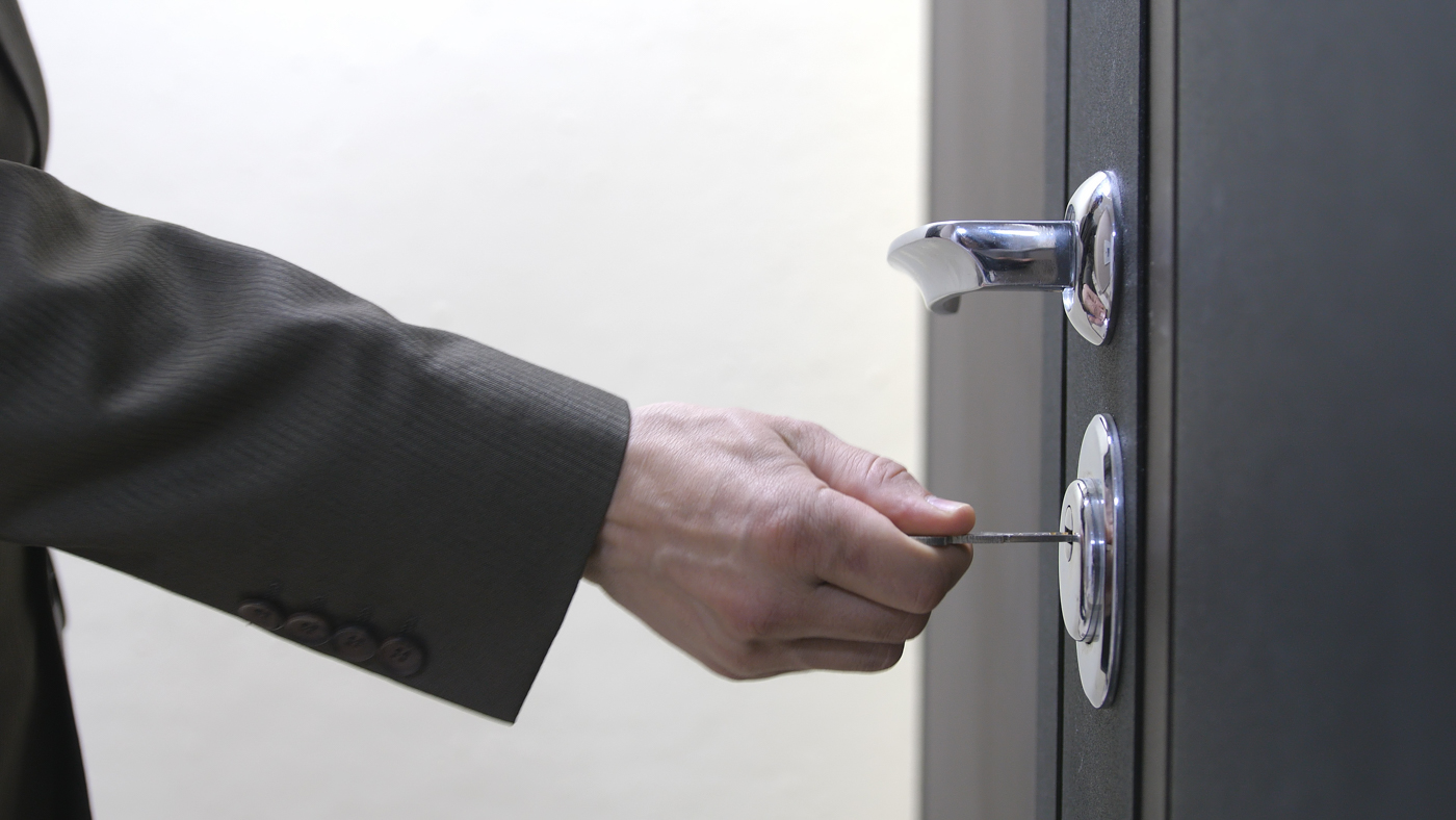 Locksmith installing mailbox lock for mail protection