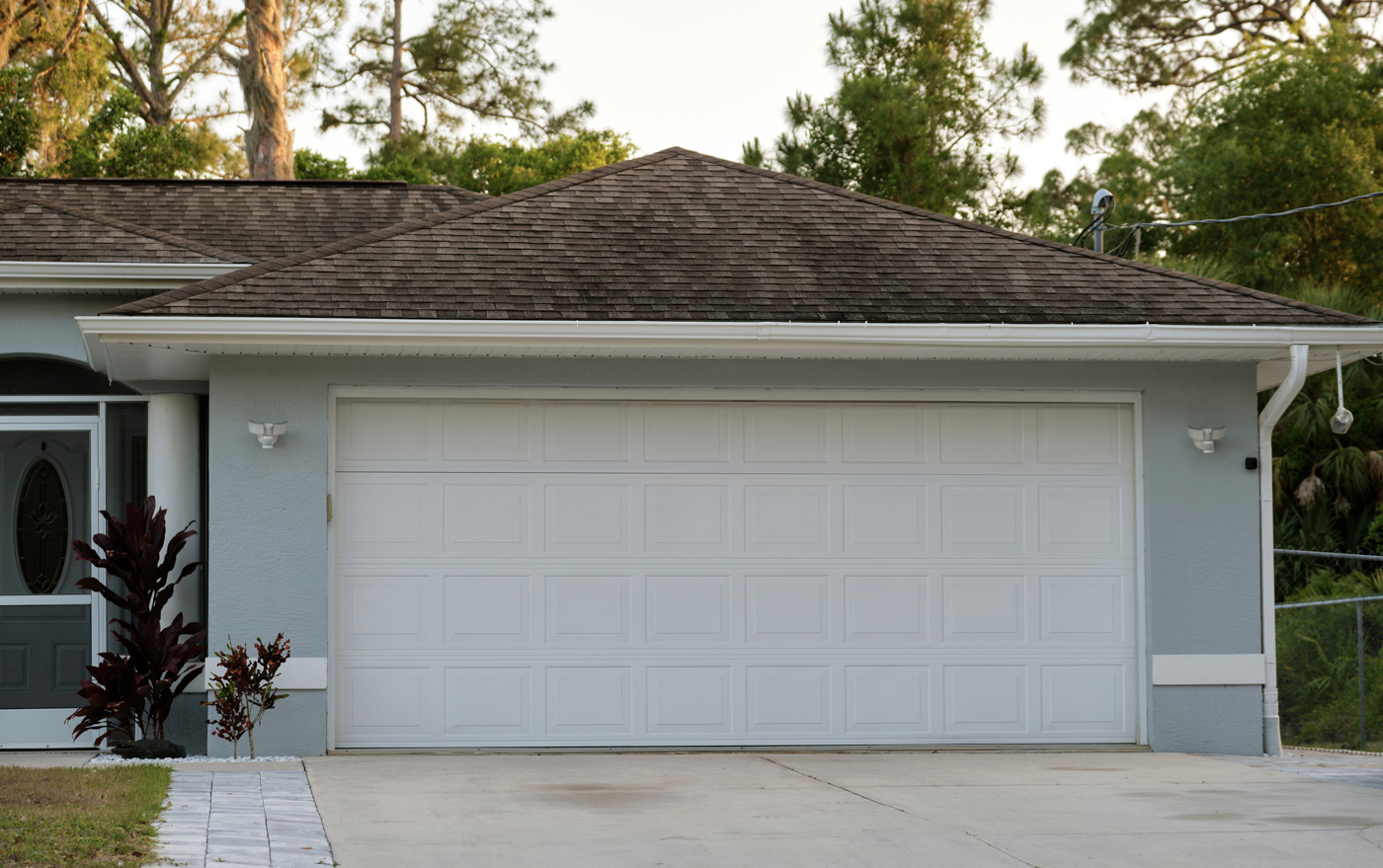 Residential home with triple garage doors