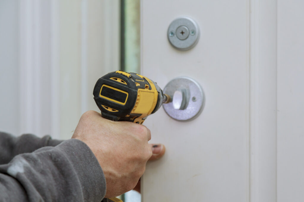 Technician installing commercial lock