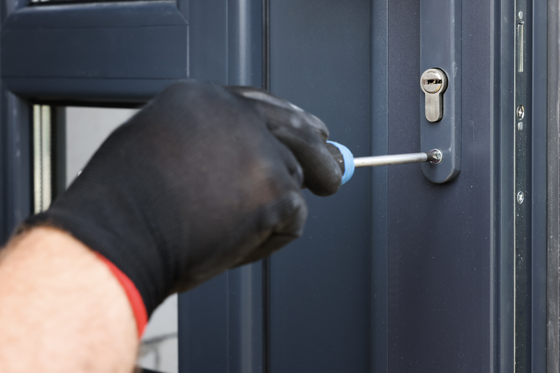 Technician installing commercial lock