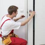 Door installation on white exterior door