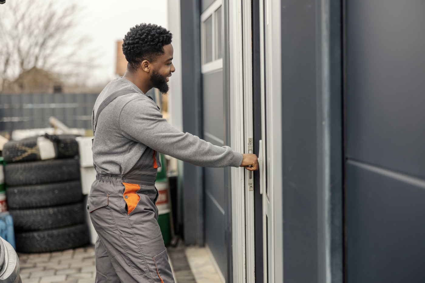 Technician repairing residential garage door
