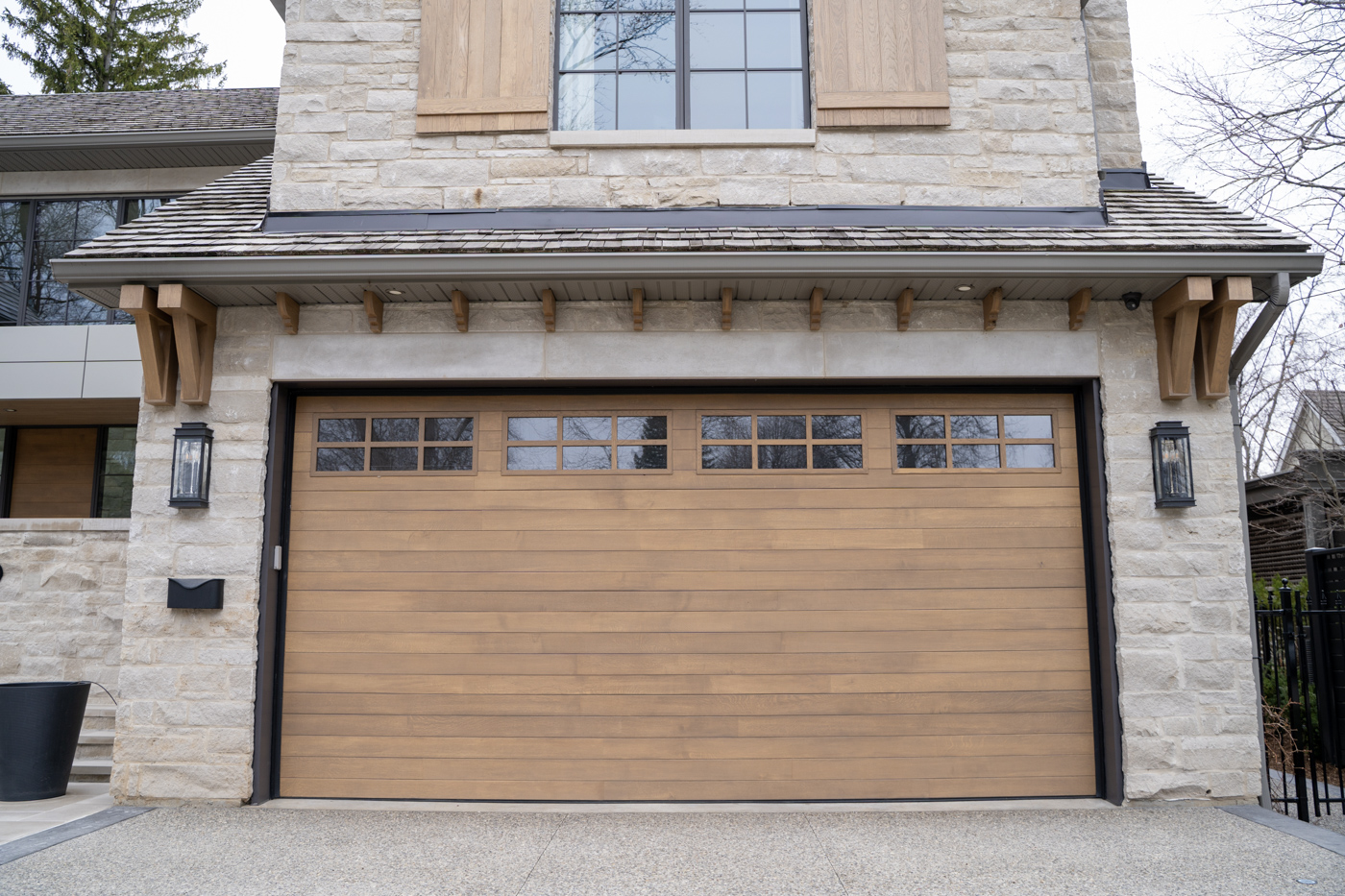 Modern wood garage door colours on Canadian home