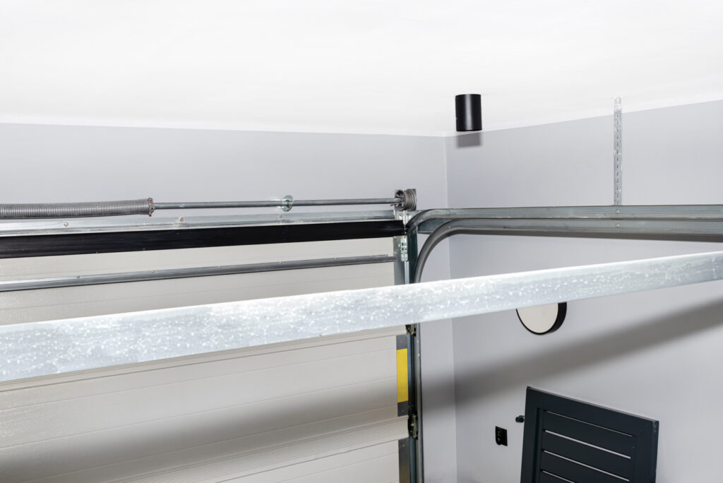 Garage door opener repair track and spring