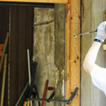 Technician installing residential garage door