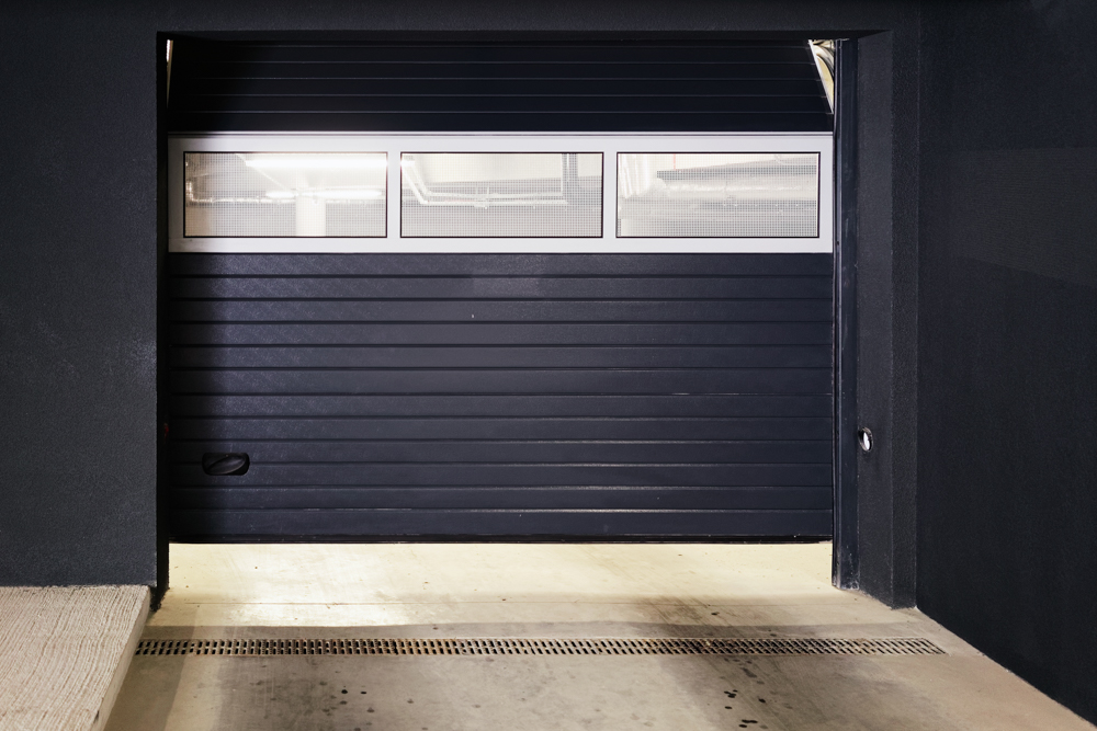 Black garage door with top windows