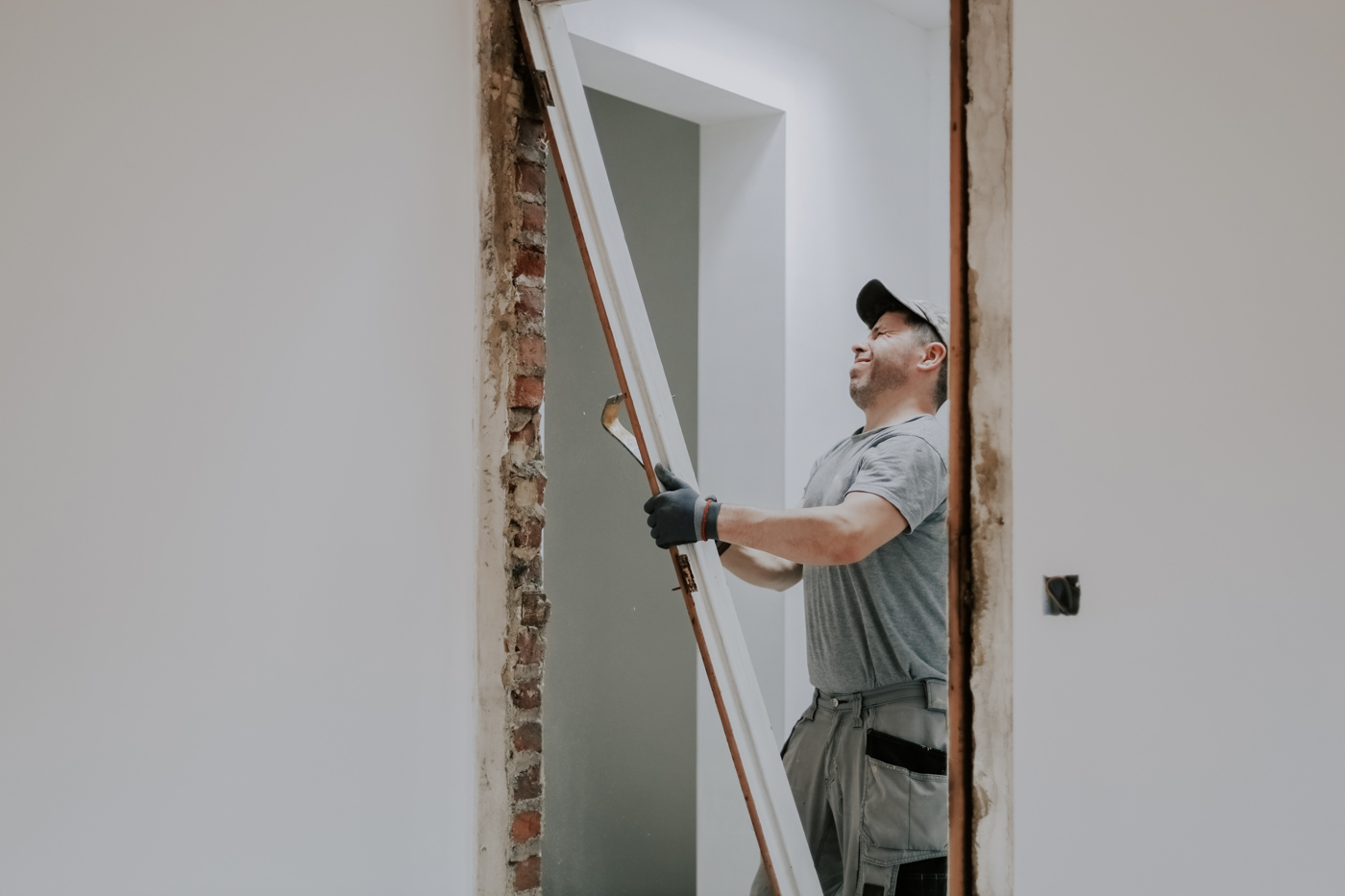 Worker installing large picture window