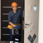Technician installing commercial security door