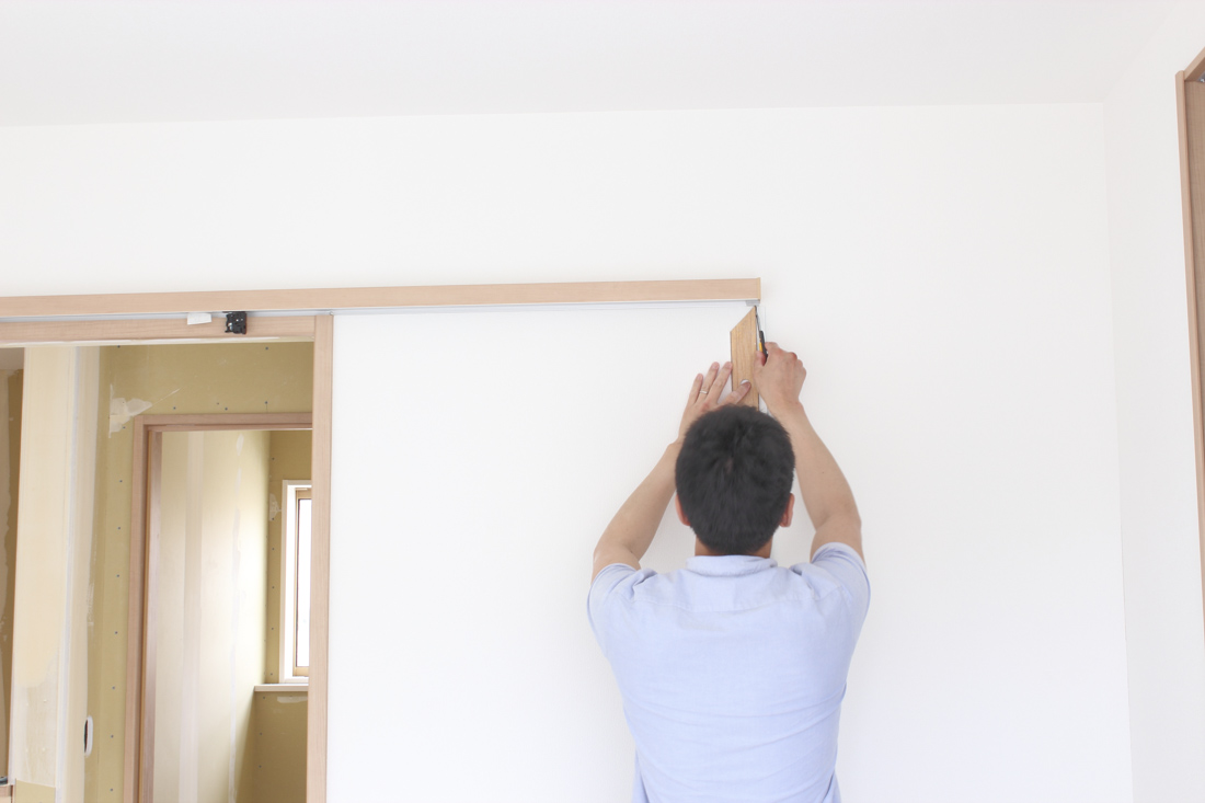 Sliding barn door installation in modern home