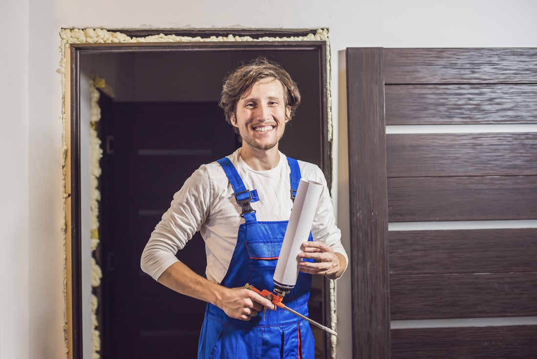 Contractor sealing door during installation