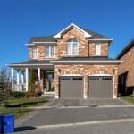 Luxury garage door with windows on Canadian home
