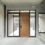 Home window installation with wood door