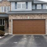 Residential garage door on Canadian home driveway