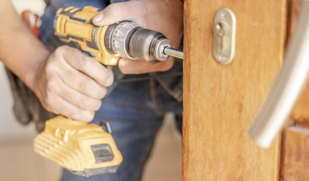 Healthcare locksmith installing hospital lock