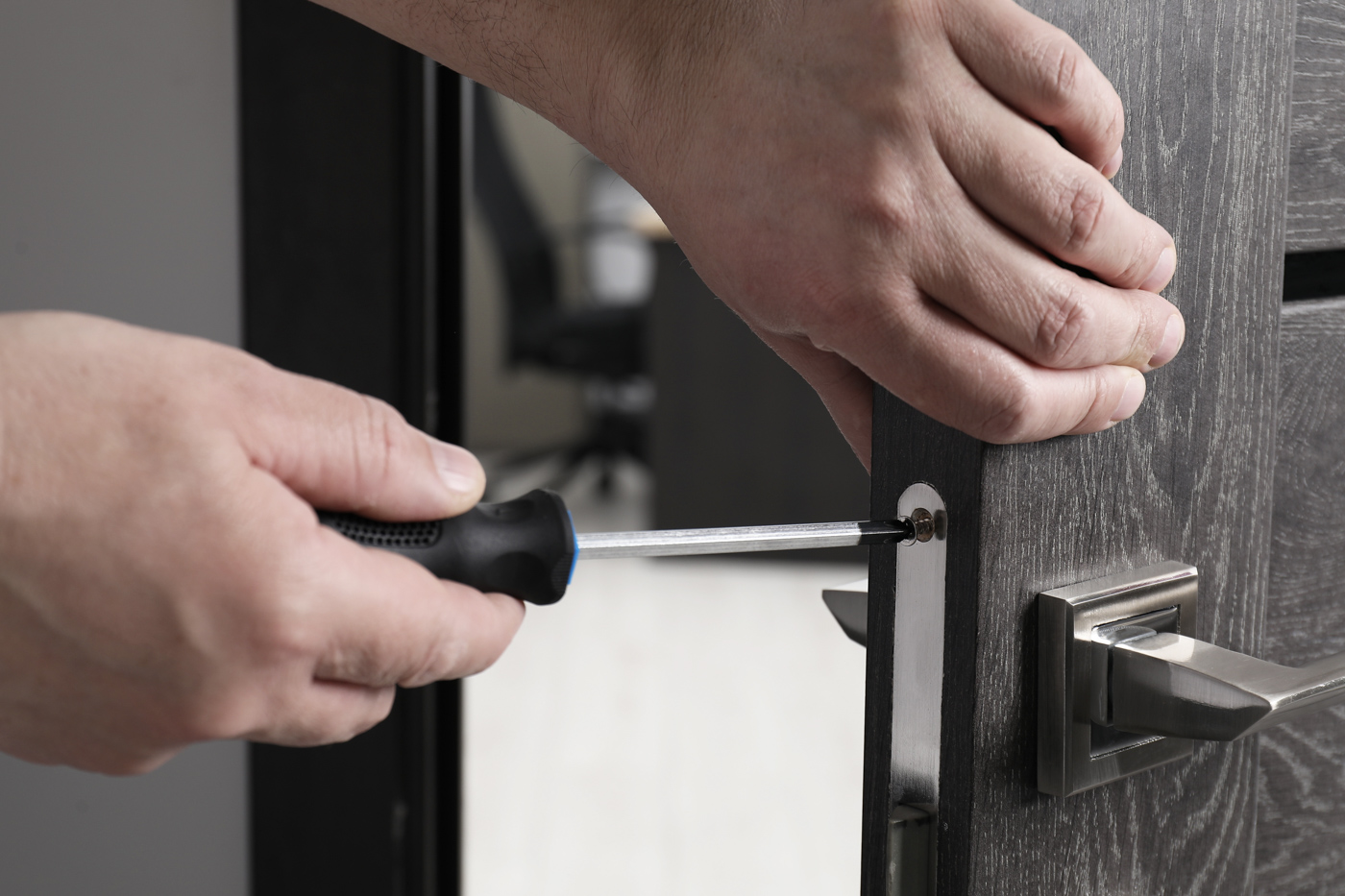 Door handle repair on modern home door
