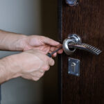 Locksmith repairing door access lock
