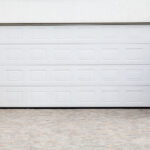White residential garage door panel repair